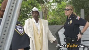 Black criminal in suit receives wet BJ from busty milf cop team