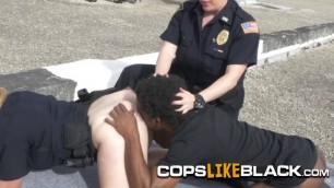 Black dude gets arrested for having a big cock hiding in his pants by two horny milf cops