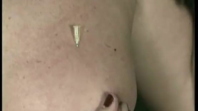 Milf slave gets needles on her tits pulled on her nipples and clamps on her pussy
