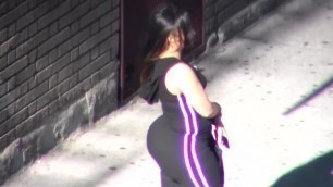 Big ass standing on street