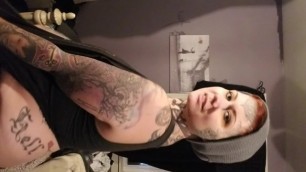 Sexy tattooed lesbian milf doing housework. strip tease. smoking mary jane
